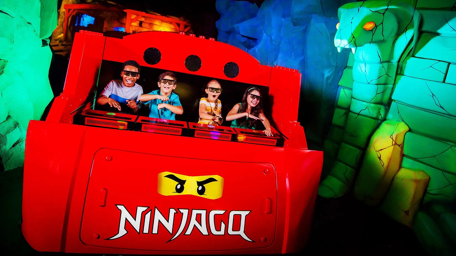 Guests aboard Lego Ninjago The Ride