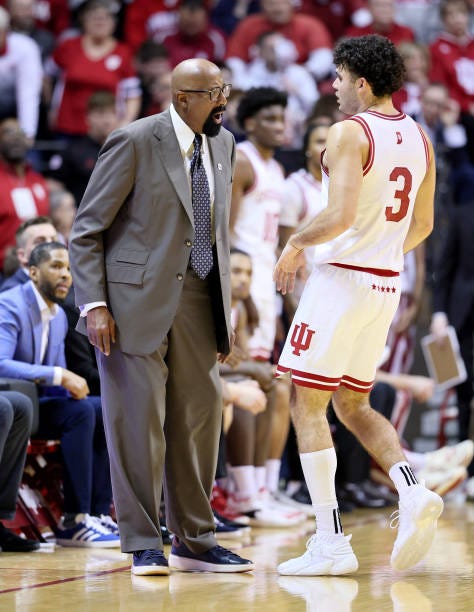 Mike Woodson the head coach gives instructions to Anthony Leal of the Indiana Hoosiers in the second half of the 74-68 win over the Iowa Hawkeyes at...