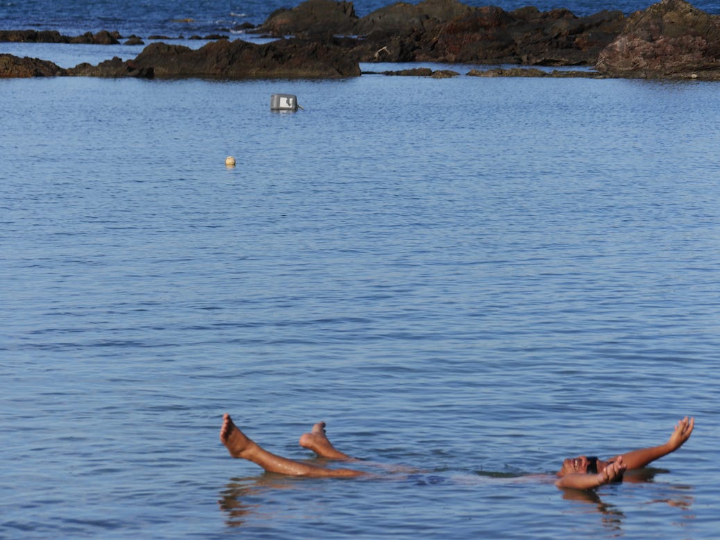 Man floating in the sea not worrying about anything