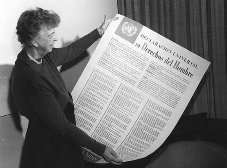 Eleanor Roosevelt holding the Universal Declaration of Human Rights, 1948 which is a document in the literal sense.