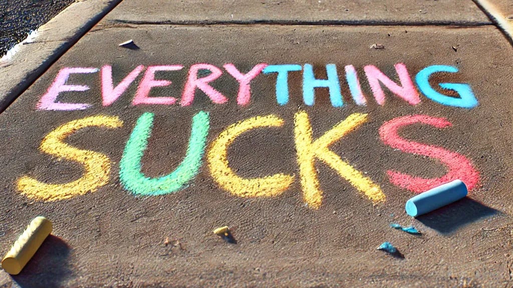 A photorealistic image of a concrete sidewalk with the words 'Everything Sucks' written in colorful chalk. The scene is in natural daylight, showing a slightly worn sidewalk texture, with the writing appearing casually done, as if by a passerby. There are small pieces of colored chalk nearby, suggesting recent use.