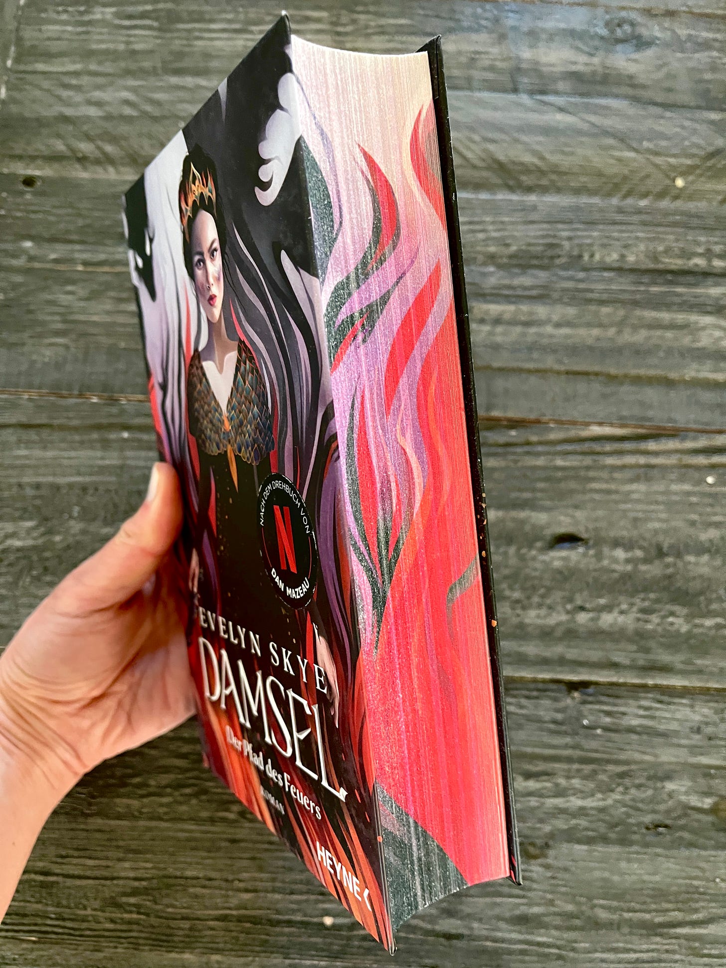 German edition of DAMSEL by Evelyn Skye, with painted edges like dragon fire