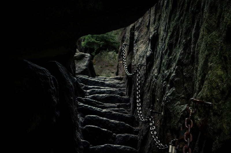 dark stone stairway out of a tunnel into the light dark stone stairway out of a tunnel into the light