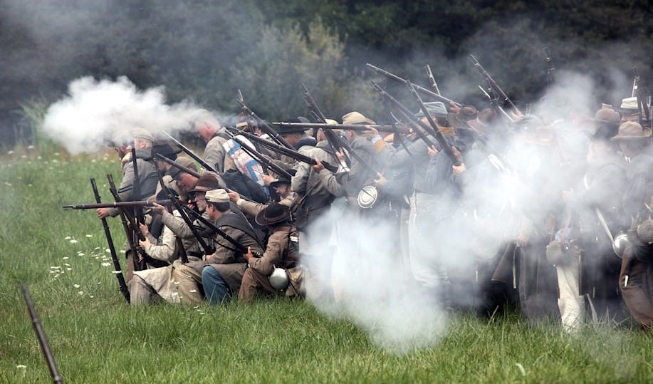 men holding rifles men holding rifles