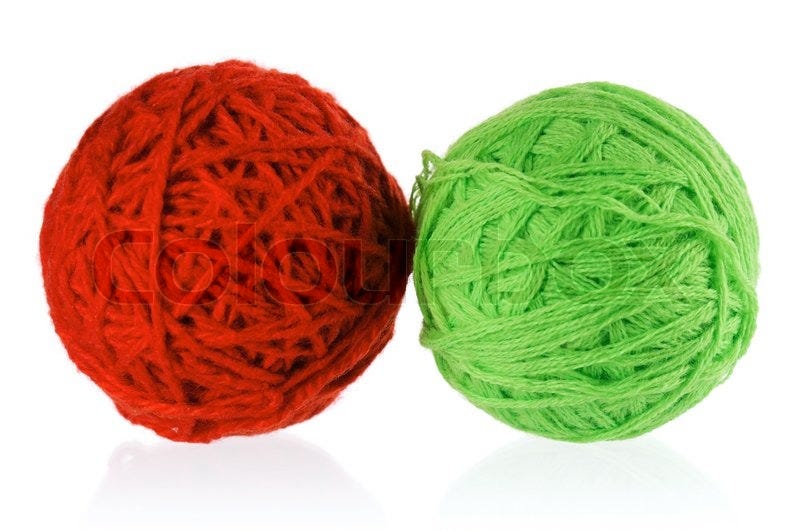 Red and green balls of yarn | Stock image | Colourbox