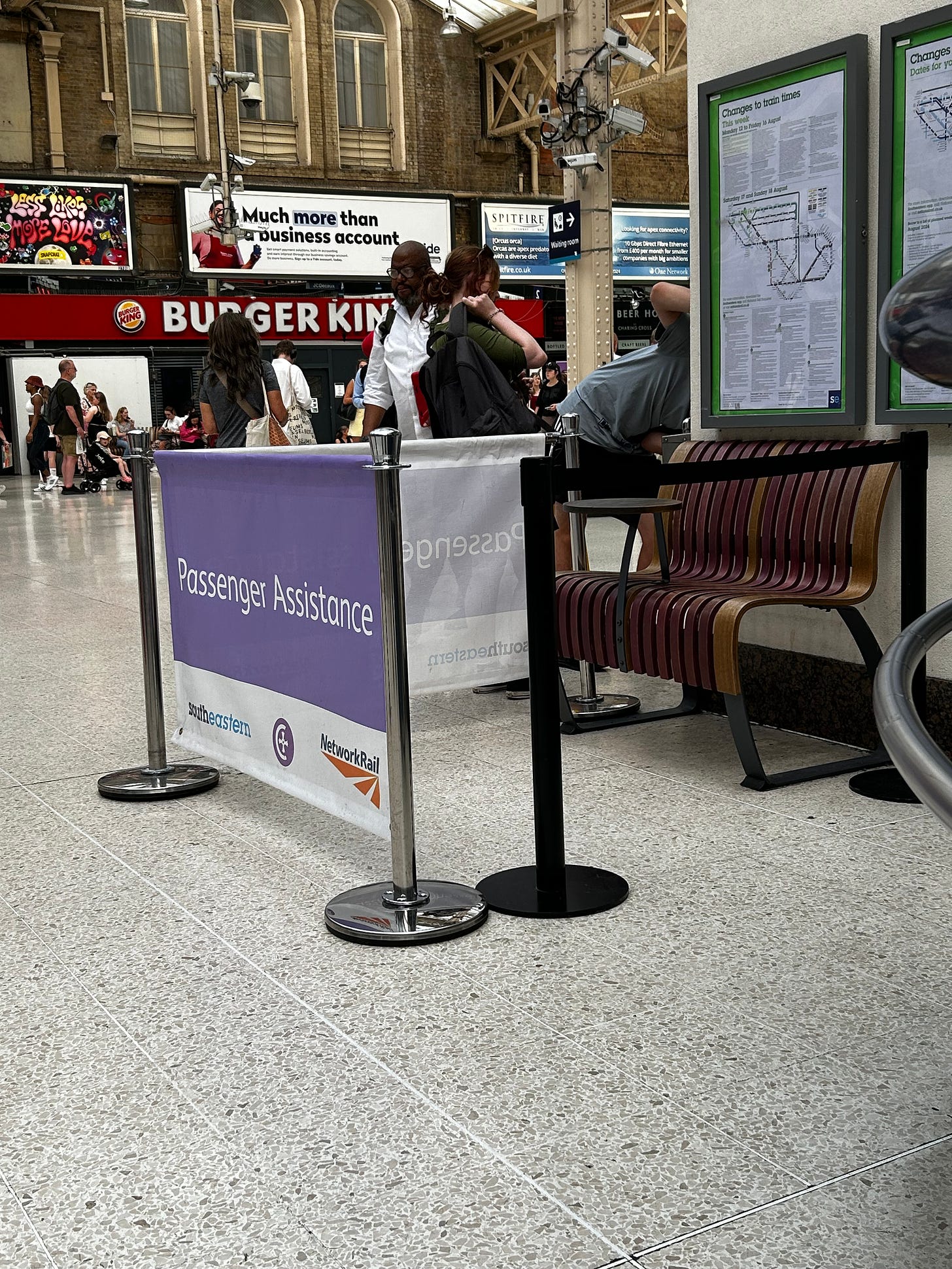 The Assisted Travel area at London Charing Cross, not much bigger than the bench, surrounded by barriers.