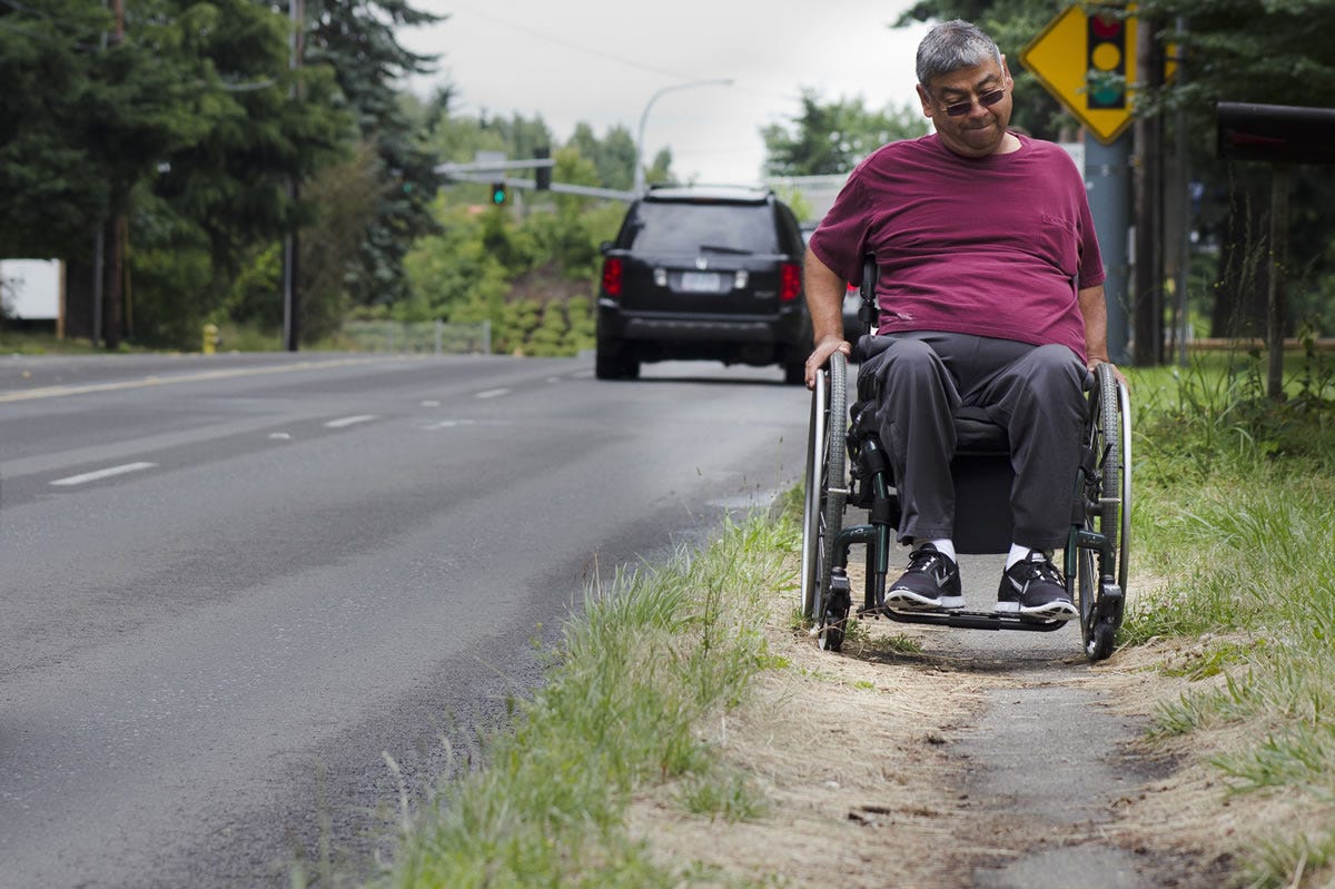 Wheelchair-bound man runs into sidewalk roadblocks - The Columbian
