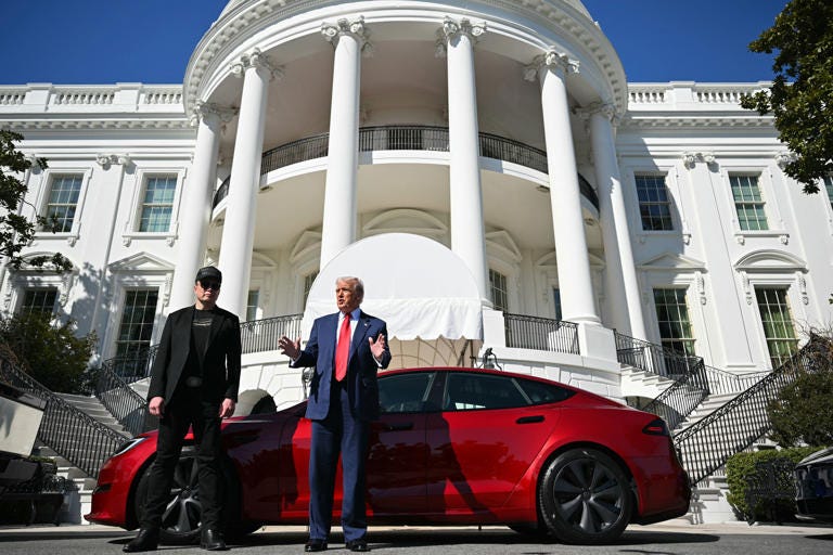 US President Donald Trump and Tesla CEO Elon Musk speak to the press as they stand next to a Tesla vehicle on the South Portico of the White House on March 11, 2025 in Washington, DC. (Photo by Mandel NGAN / AFP) (Photo by MANDEL NGAN/AFP via Getty Images)      (Photo: MANDEL NGAN via Getty Images)