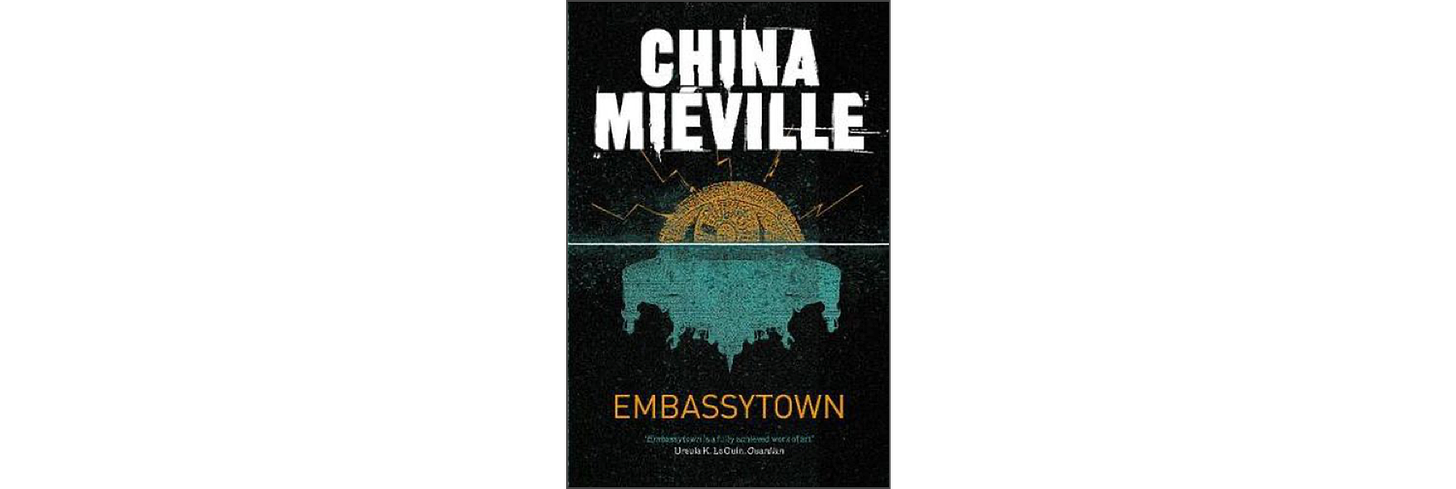 The cover of "Embassytown" by China Miéville. A stylised two colour image at centre shows an alien city at top with a "reflection" of a more complex city below.