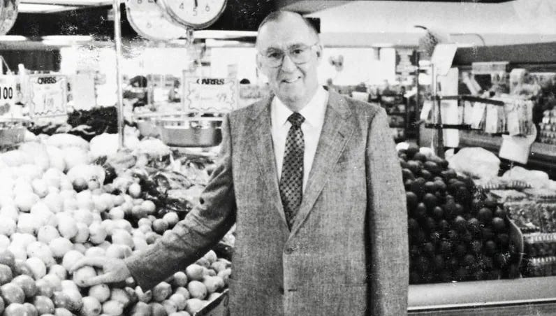 Larry Carr stands in one of his several gracery stores in Anchorage, Alaska.