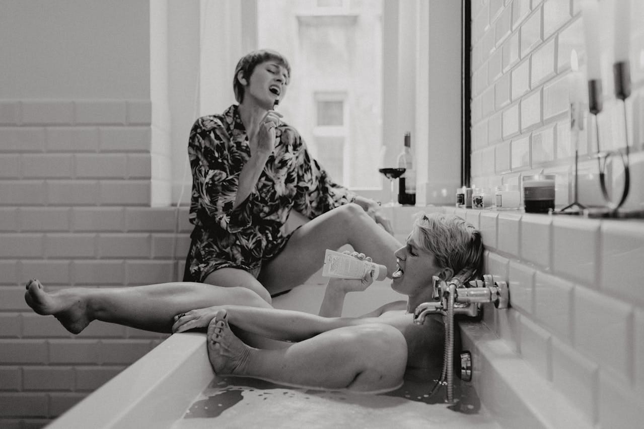 Woman casually sitting in the bathroom and singing