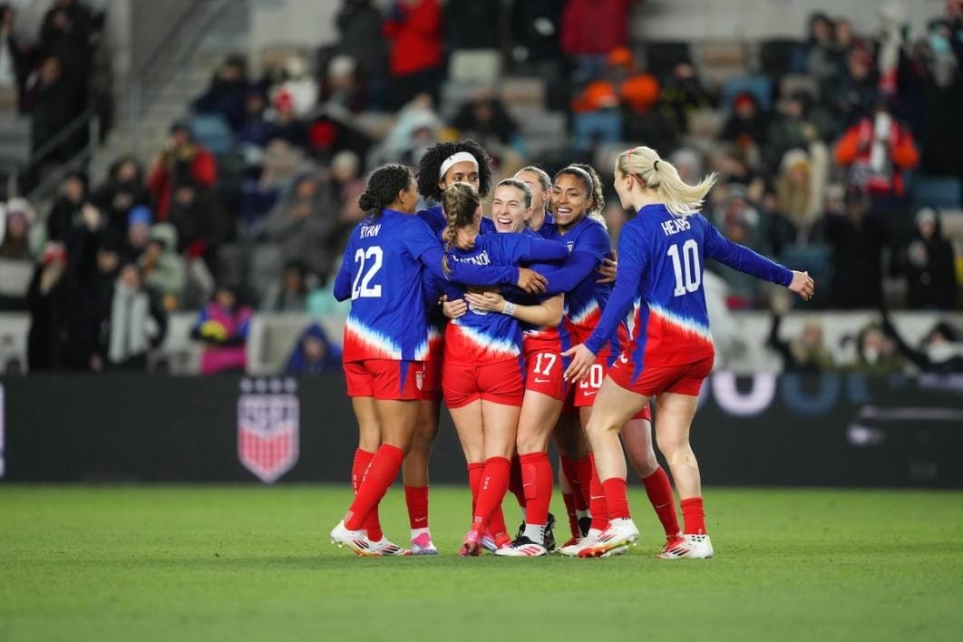 The US Women's National Team celebrates after scoring a goal against Colombia