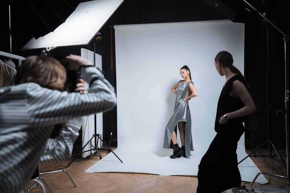 Model posing in front of a backdrop