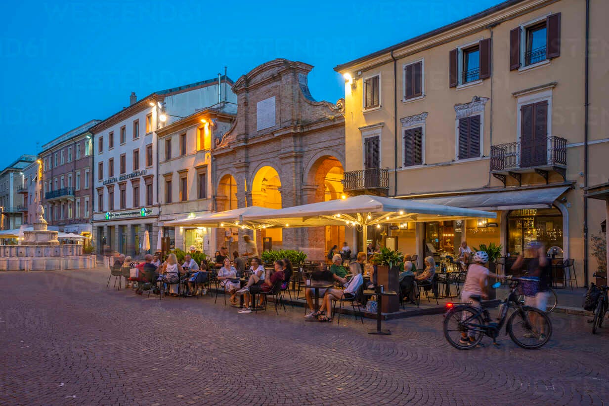 View of restaurant in Piazza Cavour in Rimini at dusk, Rimini,  Emilia-Romagna, Italy, Europe stock photo