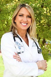 Carrie Madej in full color in her white coat