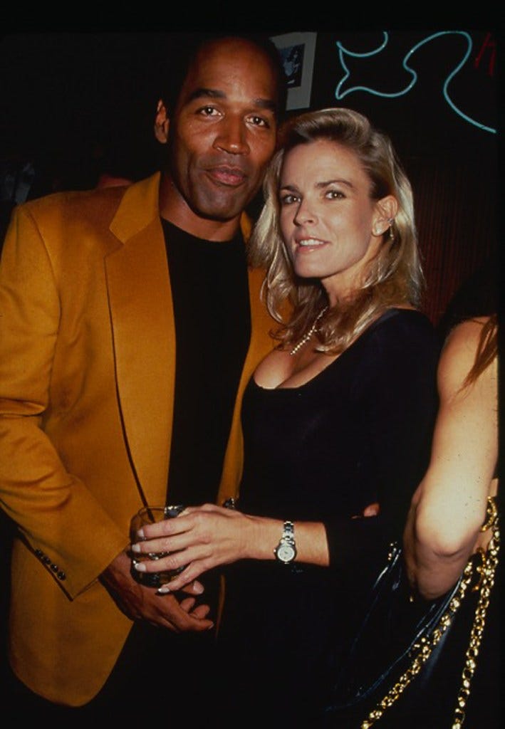 O.J. Simpson and Nicole Brown Simpson posing together at a party at the Harley Davidson Cafe in New York, 1993.