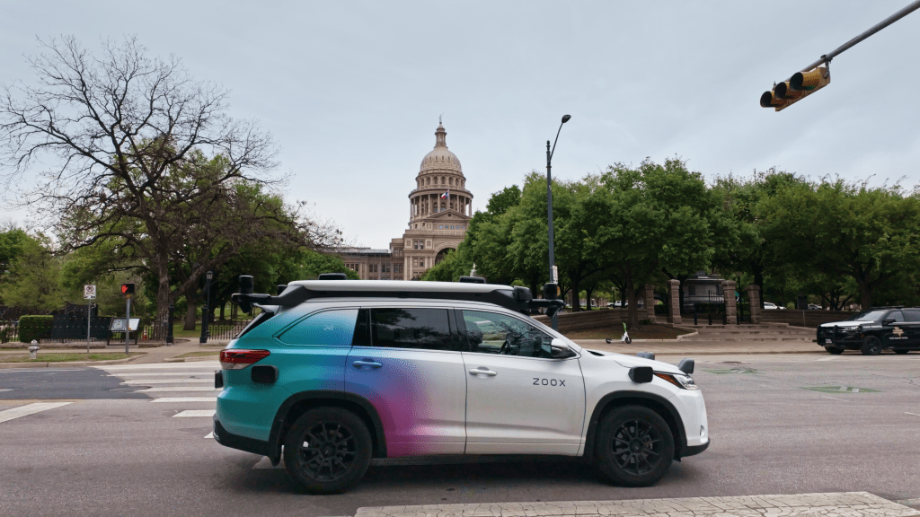 Zoox Toyota Highlander autonomous vehicle side view on street in Austin, Texas