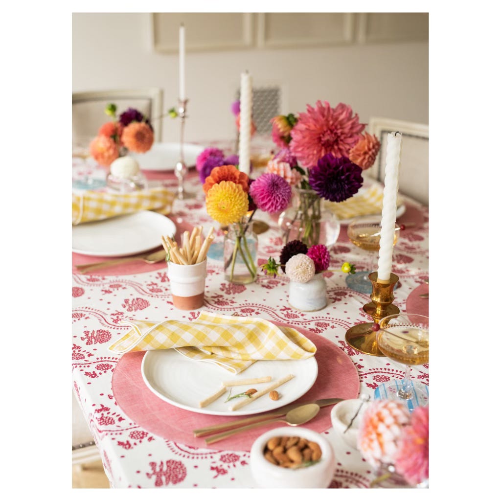 pink placemats and dahlias with yellow and white checked linen napkins 
