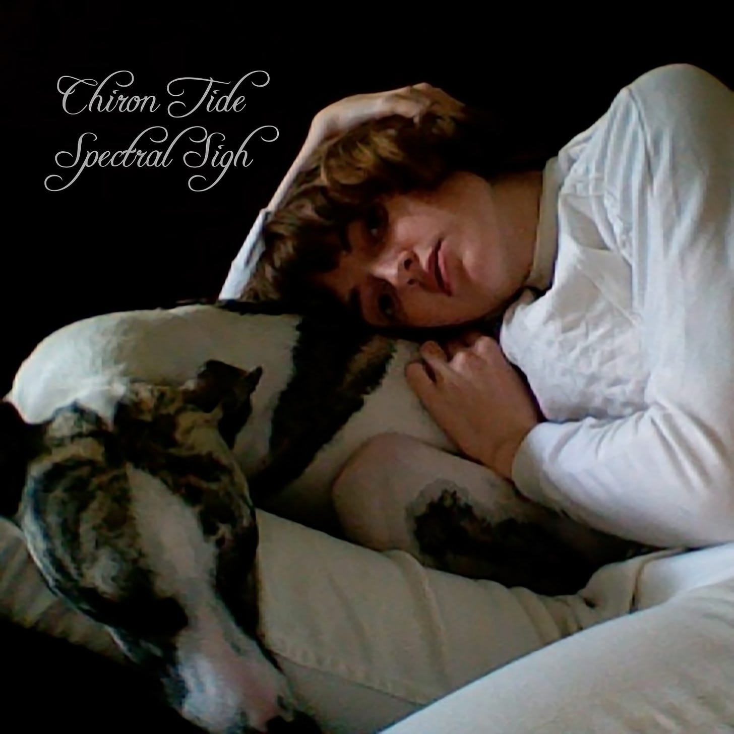 white cursive text reads "Chiron Tide Spectral Sigh" in the upper left corner above an image of a woman lying against a curled up white and brindle whippet. she holds her hair up and has a serious look on her face. she wears a white sweatshirt and white jeans.