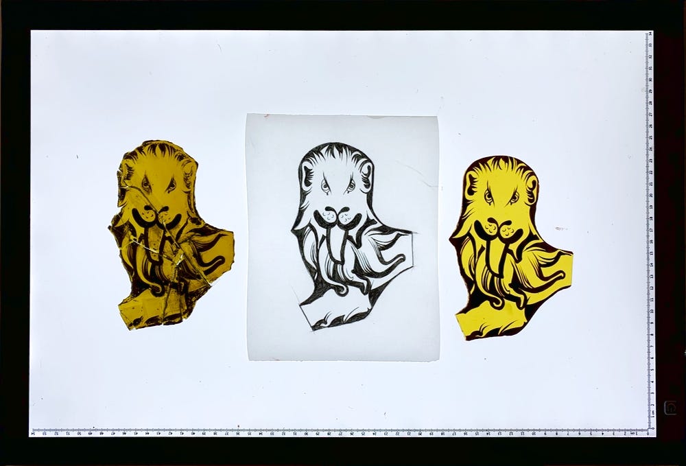 Original stained glass lion, design, and repainted stained glass lion