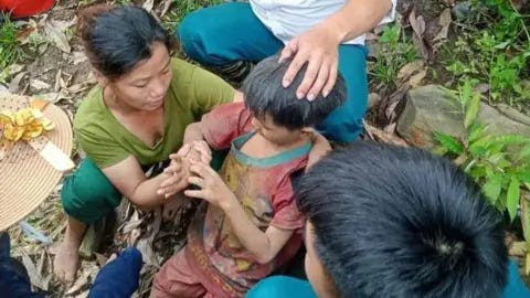 Vietnamese state media Dang Tien Lam was found by locals who heard a child's cry coming from the trees  