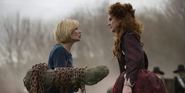 This image shows the Thirteenth Doctor (played by Jodie Whittaker) chained to a "dunking tree" that will supposedly determine her status as a witch in "The Witchfinders" (Doctor Who Series 11's eighth episode). The Doctor, left, confronts Becka Savage (played by Siobhan Finneran), right, as they face one another. This image shows the Thirteenth Doctor (played by Jodie Whittaker) chained to a "dunking tree" that will supposedly determine her status as a witch in "The Witchfinders" (Doctor Who Series 11's eighth episode). The Doctor, left, confronts Becka Savage (played by Siobhan Finneran), right, as they face one another.