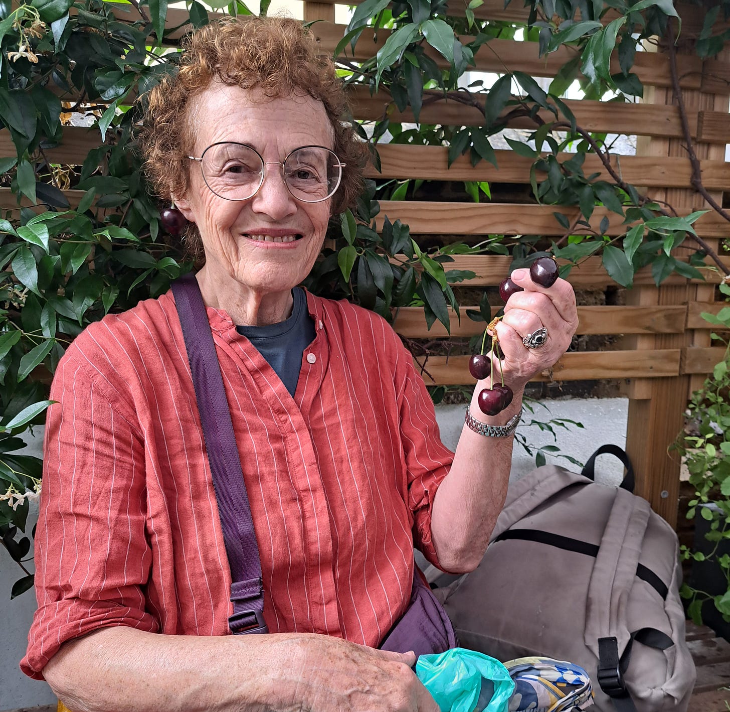 Elisabeth Luard, at Notting Hill farmers market with cherry garnish