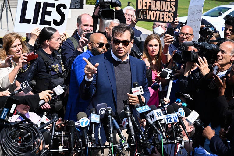 Santos leaves federal court on May 10, in Central Islip, N.Y. (Lokman Vural Elibol/Anadolu Agency via Getty Images)