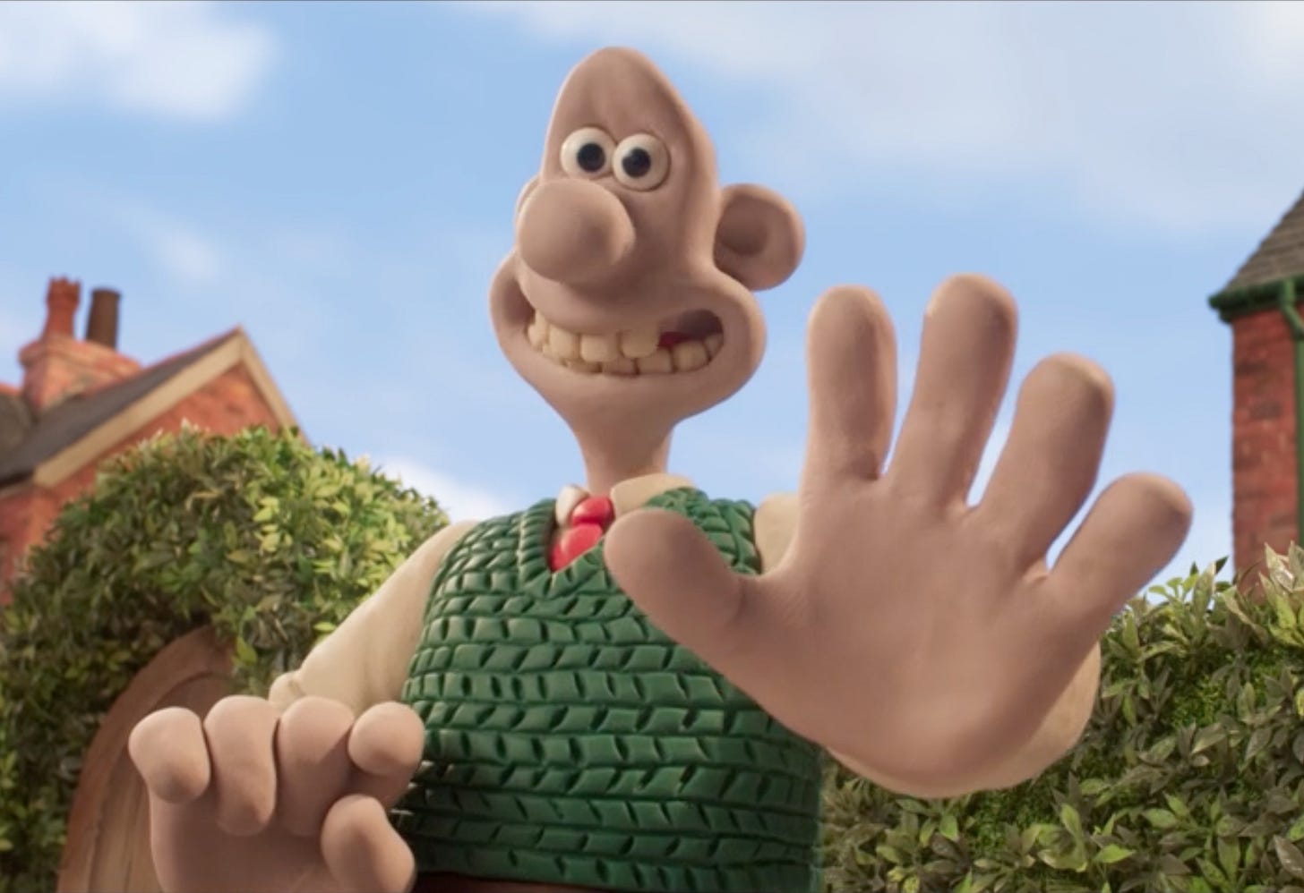 Wallace reaching out to pat Gromit on the head