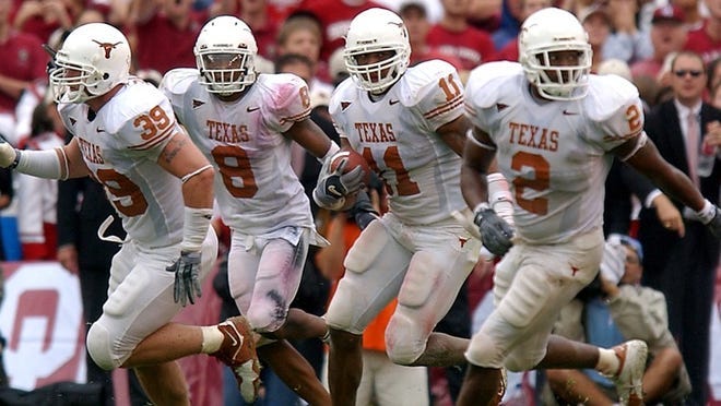 Deborah Cannon/American-Statesman From left, Texas' Brian Robison, Cedric Griffin, and, at far right, Aaron Harris, guard teammate Derrick Johnson as he recovers a turnover against Oklahoma at the Red River Shootout in Dallas, Texas, on Saturday, October 9, 2004. ORG XMIT: UT PEp Talk