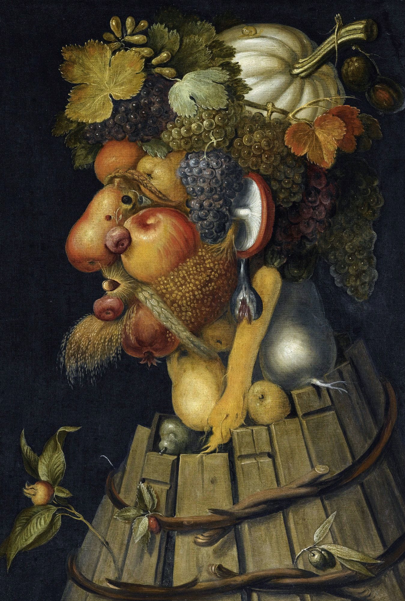 A figure constructed of autumn fruits and vegetables