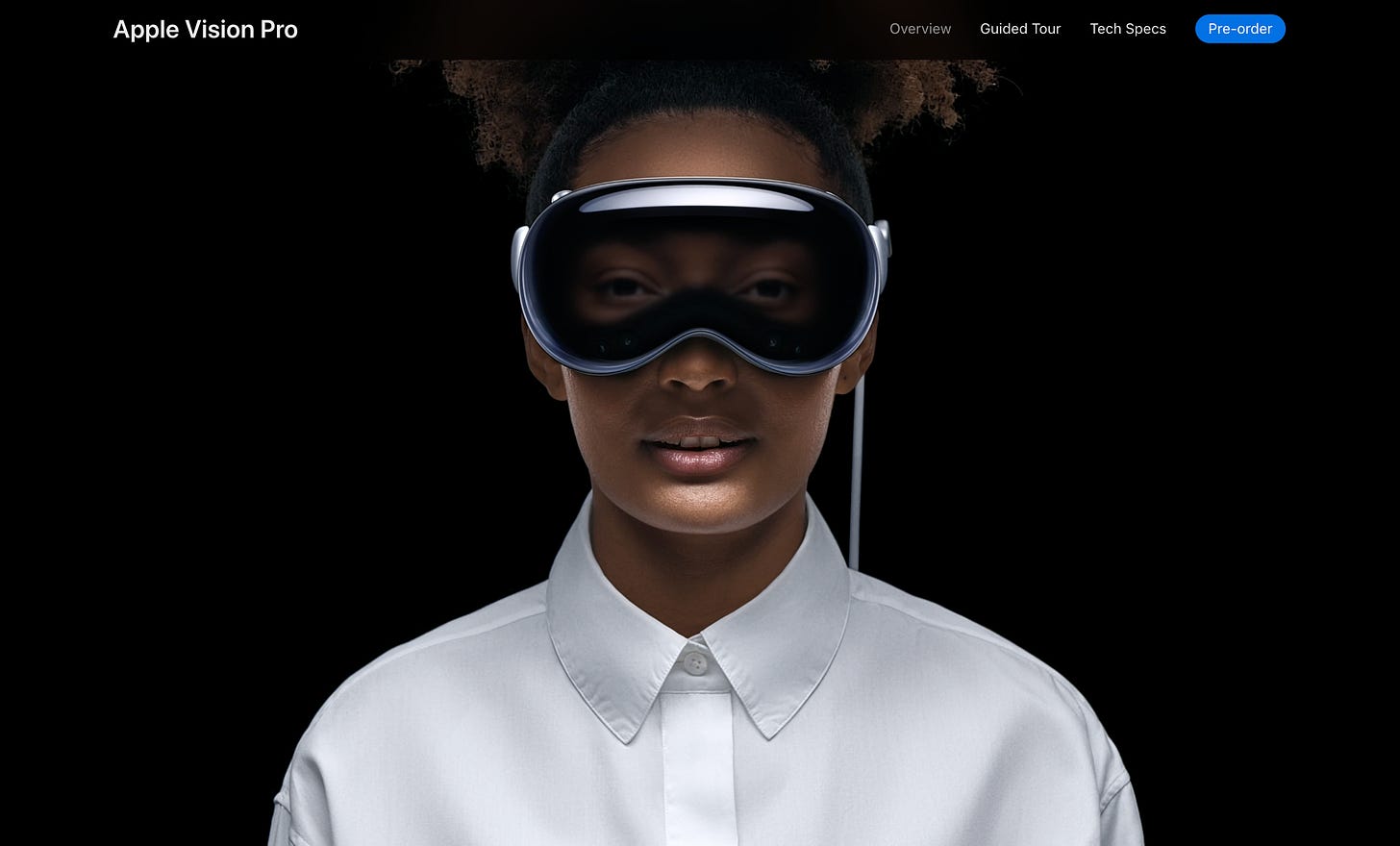 A Black woman wearing the new Apple Vision Pro. She's wearing a white shirt. Her eyes are projected on the ski goggle-like headset.