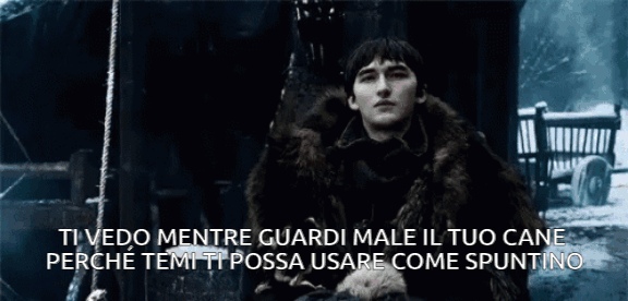 Personaggio maschile con un mantello di pelliccia in una scena invernale oscura, seduto su una sedia. Lui è Brandon Stark, uno dei protagonisti della serie Games of Thrones. Il testo sovraimpresso dice: 'Ti vedo mentre guardi male il tuo cane perché temi ti possa usare come spuntino'. La GIF evoca un'atmosfera ironica e inquietante. Personaggio maschile con un mantello di pelliccia in una scena invernale oscura, seduto su una sedia. Lui è Brandon Stark, uno dei protagonisti della serie Games of Thrones. Il testo sovraimpresso dice: 'Ti vedo mentre guardi male il tuo cane perché temi ti possa usare come spuntino'. La GIF evoca un'atmosfera ironica e inquietante.