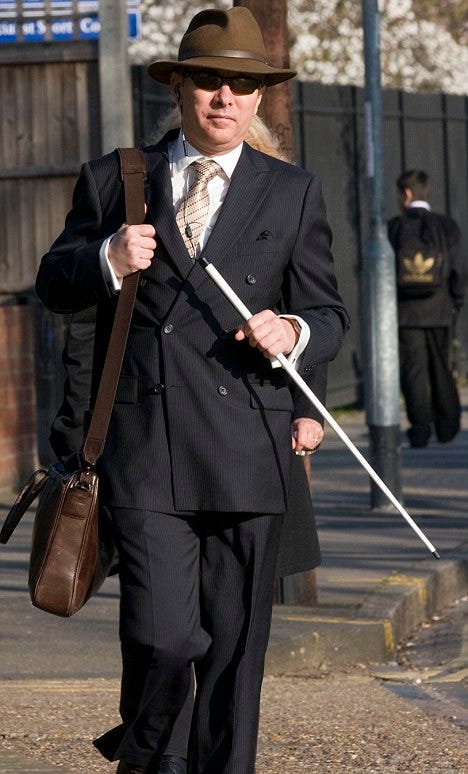Arriving at court: Cllr Andrew Lamont has been charged with 22 counts of making or possessing indecent images of both children and animals He is pictured here arriving at Isleworth Crown Court today