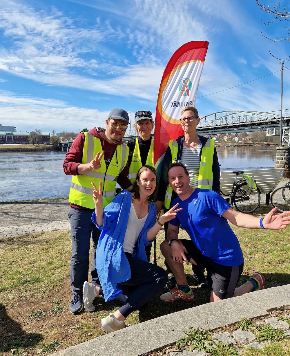 Volunteers posing by the river