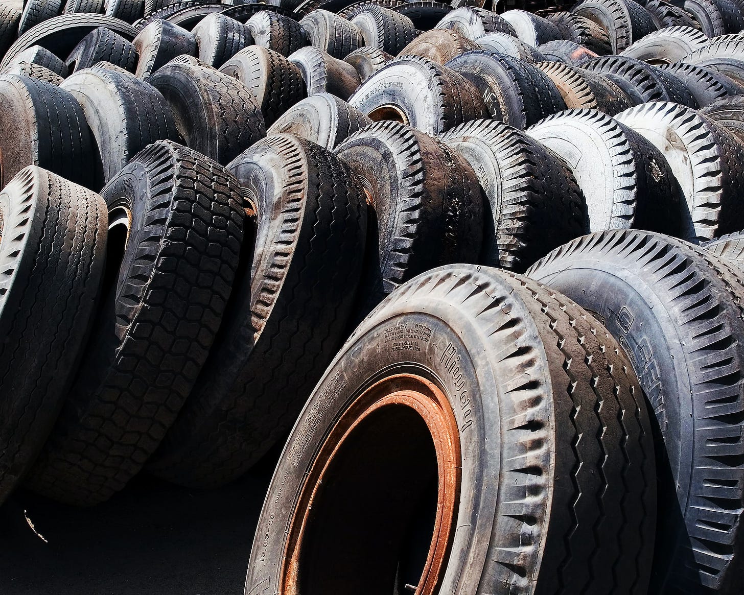 Tires awaiting recycling. Tubeless tires are better for the environment as they are seldom replaced and increase fuel efficiency, hence reducing your car's carbon footprint.