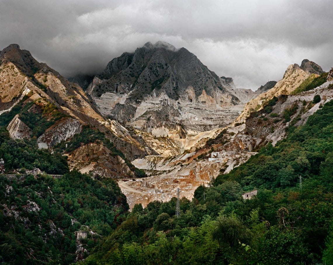 High top view of a mountain with clouds in the background