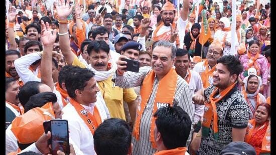 BJP candidate Sanjay Tandon with party workers at a roadshow in Chandigarh on Sunday. (HT photo)