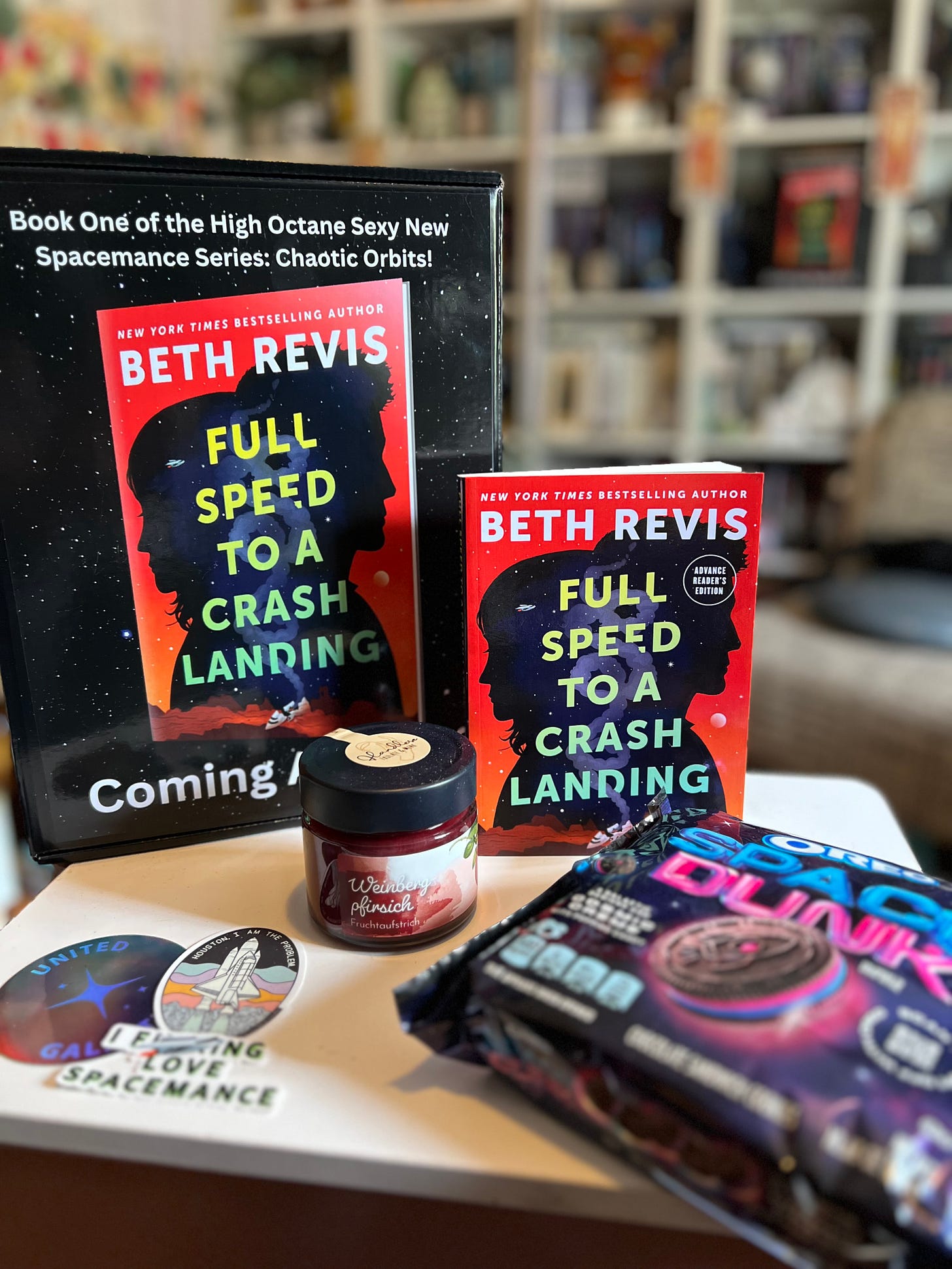 ARC of Full Speed, a jar of jam, Oreo Space Dunk cookies, and stickers
