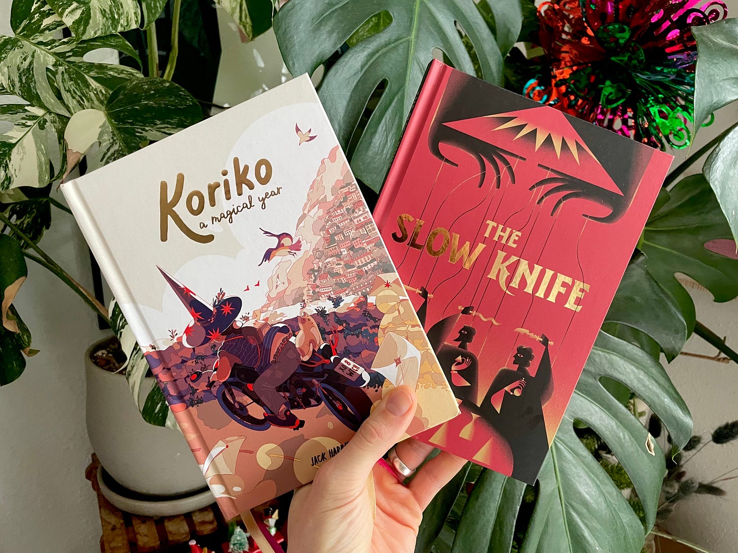 A photo of two books: Koriko and The Slow Knife
