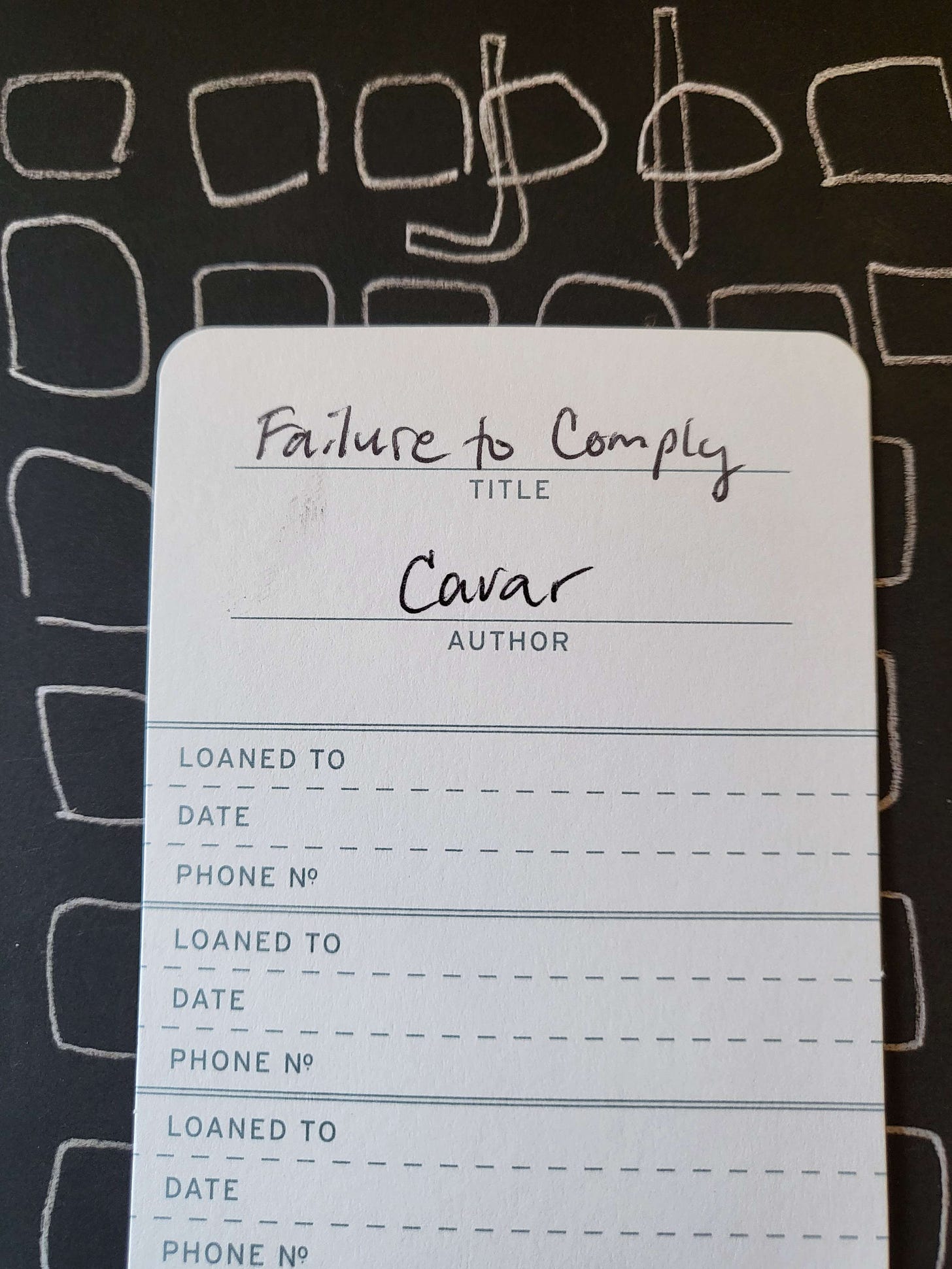 A library-like card that says Failure to Comply by Cavar on top of the book