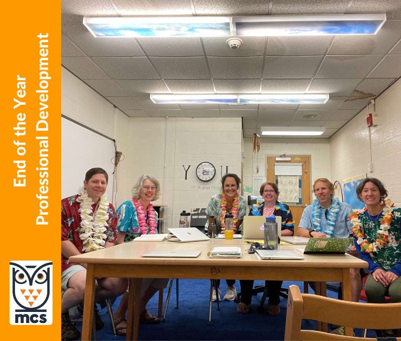 staff member around the table wearing Hawaiian themed shirts and leis