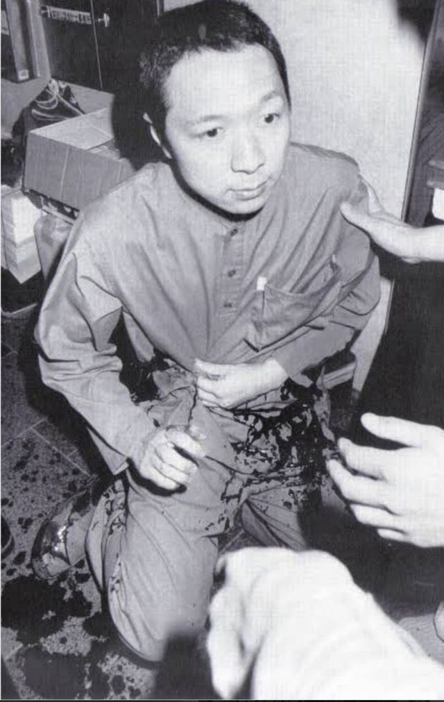 A Senior Aum Shinrikyo official Hideo Murai just after being stabbed by the Yamaguchi-gumi ...