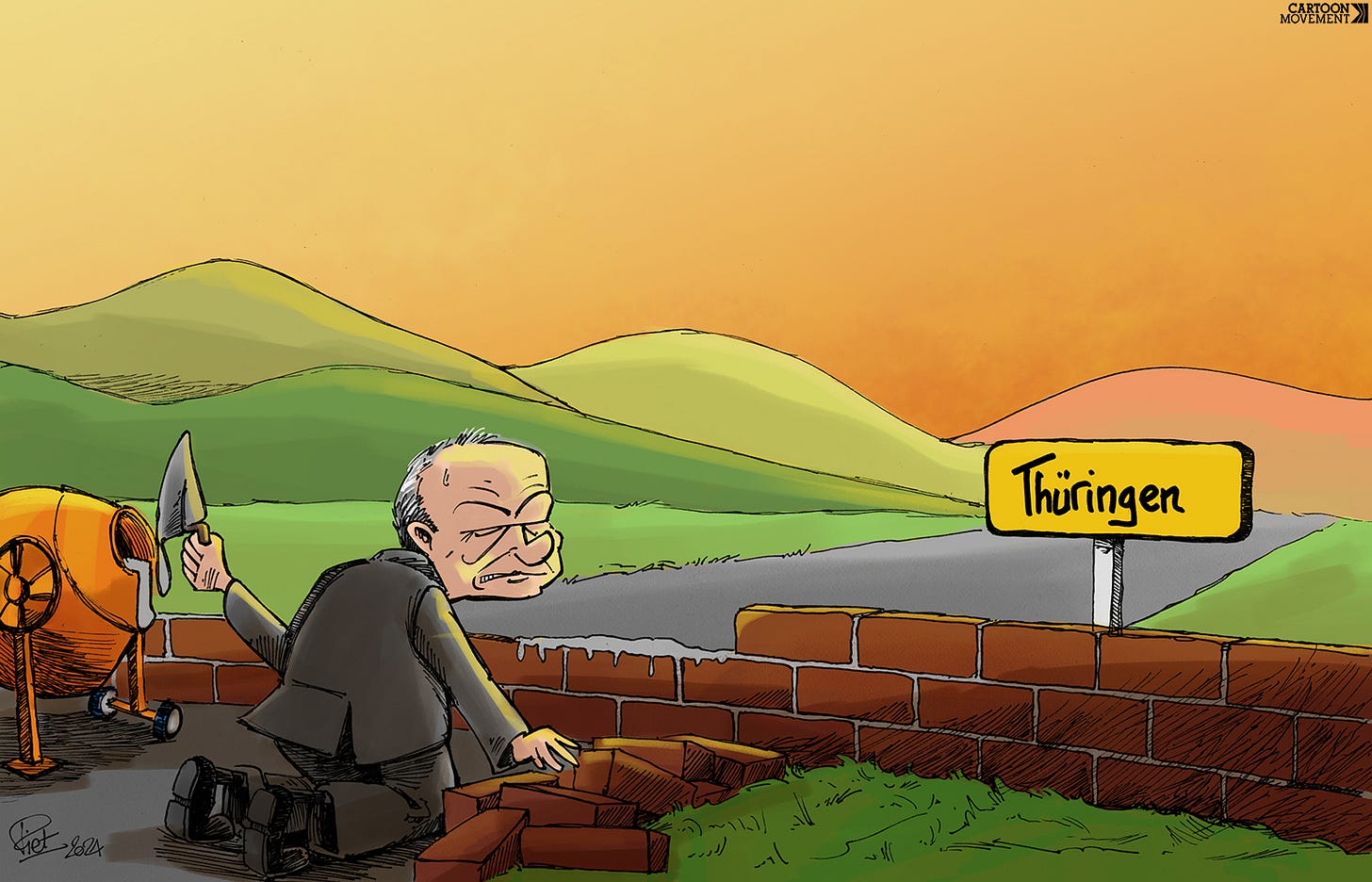 Olaf Scholz building a wall at the regional border with Thuringia.