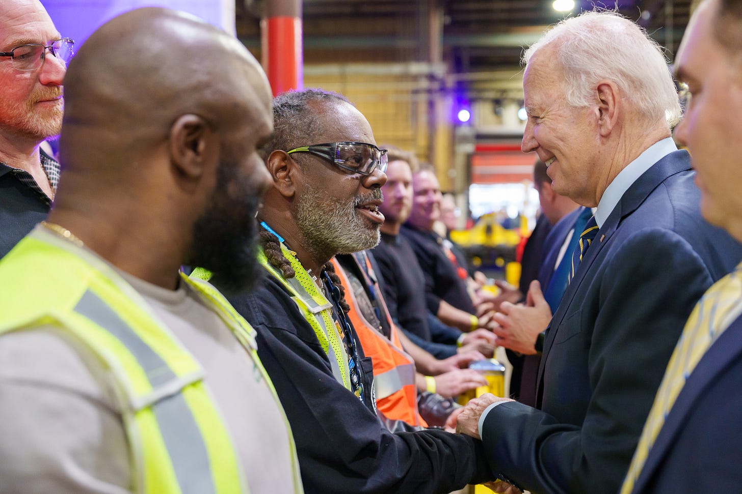 President Biden greets event attendees and Amtrak workers in Bear, Delaware.