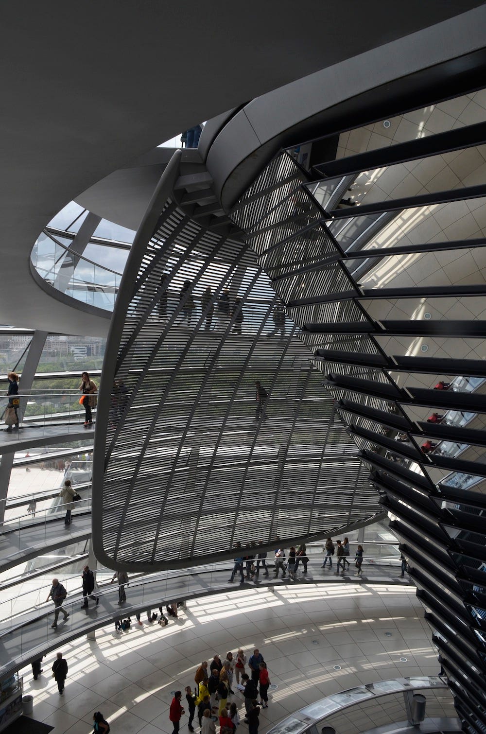 The fantastic funicular that has a set of mirrors to channel natural light into the Parliament hall below and the screen that can move around the dome to block out light that is not required