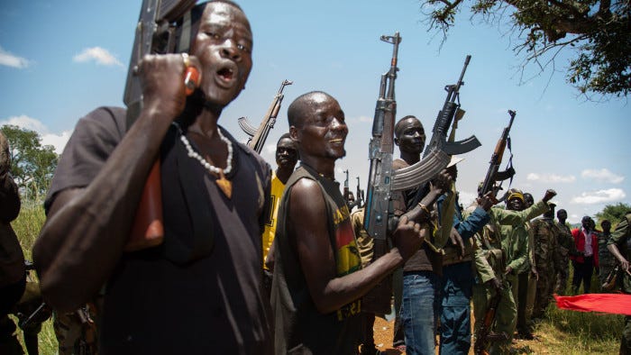 Rebels of the Sudan People's Liberation Movement-in-Opposition (SPLM-IO), a South Sudanese anti-government force, take part in a military exercise at a base in Panyume, on the South Sudanese side of the border with Uganda, on September 22, 2018. - Despite a peace deal being signed by the President of South Sudan, Salva Kiir, and opposition leader Riek Machar on September 12, conflict in Central Equatoria continues as both warring parties fight for control. (Photo by SUMY SADURNI / AFP) (Photo credit should read SUMY SADURNI/AFP/Getty Images)