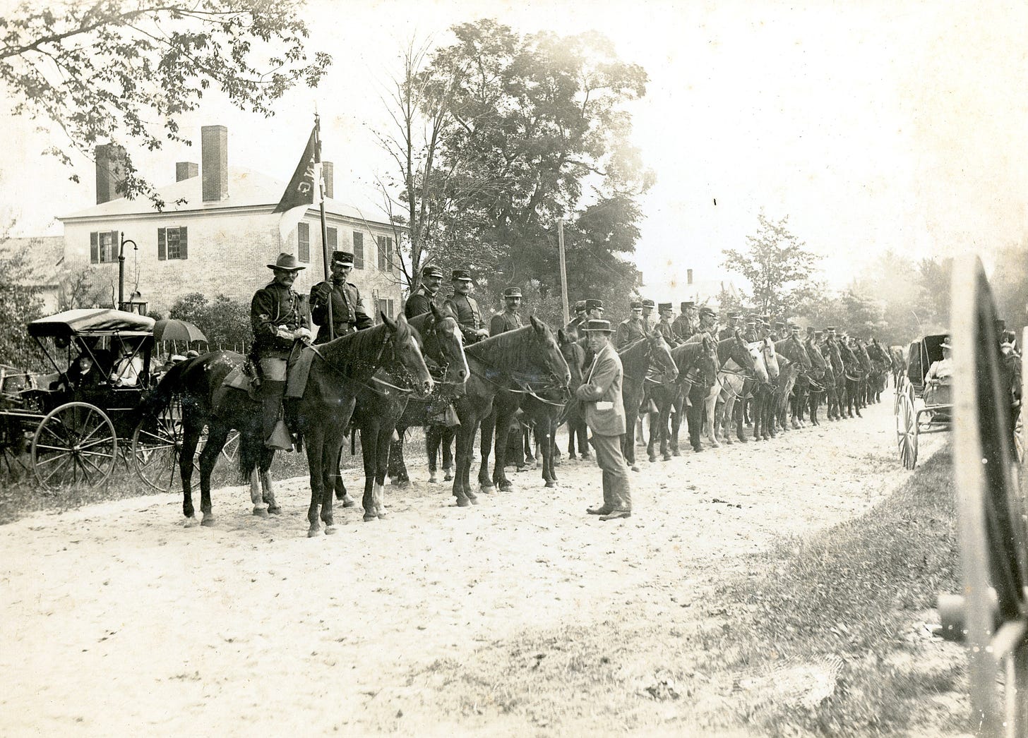 Men in uniform on horseback