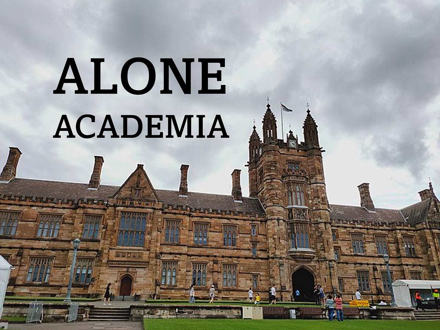 Image of ye olde university building with a cloudy sky behind it. The words Alone Academia are in large font over the sky