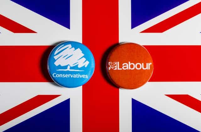 Badges for Conservatives and Labour with a union jack background